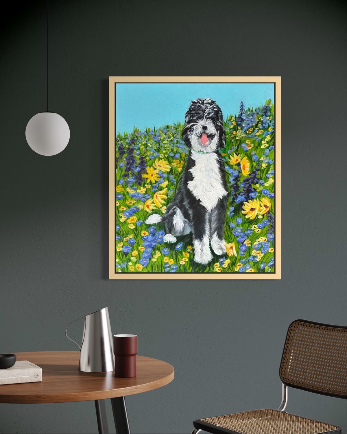 Zoya's framed portrait in a field of wildflowers, hanging above a dining table